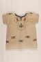 Embroidered dress worn by a Polish Jewish girl in hiding