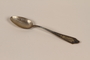 Reproduction of a spoon and box smuggled out of Warsaw ghetto with an infant