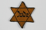 Yellow cloth Star of David badge printed with the word Jude