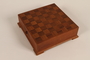 Handmade wooden checkers set presented to Director, ORT schools, DP camps