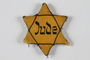 Yellow cloth Star of David badge printed with the word Jude