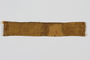 Yellow cloth strip sewn to a slave laborer's uniform to identify her as a Jew