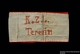 Handmade white armband embroidered K.Z.L. Terezin and worn by a female German Jewish inmate