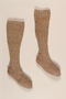 Pair of tan and white wool knit tweed patterned knee high socks brought to the US by a German Jewish refugee