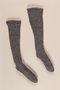 Pair of gray wool knit knee high ribbed socks brought to the US by a German Jewish refugee