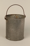 Tin pail made for one prisoner by another in Kaufering concentration camp