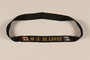 Black headband embroidered MS St. Louis worn by a young girl on board the ship