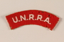 UNRRA red felt patch with acronym worn by a refugee aid worker