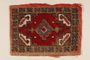 Small hooked rug used in the wagon of a Sinti family