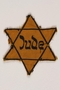 Star of David yellow cloth badge printed with Jude, the German word for Jew