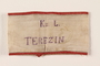 Handmade white armband stamped for medical personnel worn by an inmate in Theresienstadt