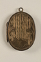 Oval locket with 2 photos of a young woman owned by emigres in Shanghai