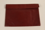 Red leather purse with decorative lacing carried by a Jewish refugee during her escape from Vienna