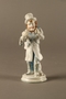 White porcelain match holder depicting a stereotypical Jewish peddler