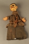 Paper mache puppet of a Jewish man in a prison uniform