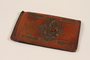 Leather wallet with an embossed floral design used by a Hungarian Jewish youth and former concentration camp inmate