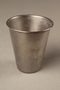 Stainless steel toothbrush rinse cup given to a Holocaust survivor in Sweden