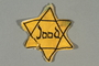 Factory-printed Star of David badge printed with Jood worn by a Jewish person