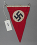 Red pennant with swastika found at a liberated concentration camp by a US soldier