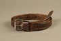 Brown leather belt worn by a Dutch Jewish political prisoner in Auschwitz-Birkenau
