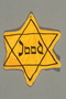 Factory-printed Star of David badge worn by a Jewish person in the Netherlands