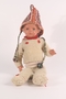 Doll's offwhite hand knit wool sweater and pants with red flowers made by a young girl after her release from Theresienstadt
