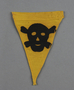Small, yellow warning pennant with a skull and crossbones acquired by a US soldier