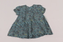 Child's flowered blue dress received by girl in DP camp