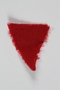 Red wool triangular inmate badge retrieved by a US soldier at a concentration camp