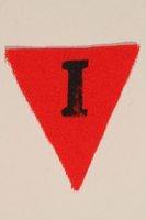 1989.295.4 front
Unused red triangle concentration camp patch with an I found by a US military aid worker

Click to enlarge