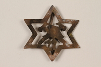 1995.89.1089 front
Kovno Ghetto Fire Brigade badge with a Star of David

Click to enlarge