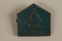 Green metal Werk Kratzau labor camp badge worn by an inmate
