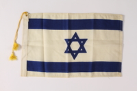 2011.447.4.2 front
Tasseled Israeli Flag owned by an aid for the mayor of New York City

Click to enlarge