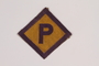 Forced labor badge worn by a Roman Catholic Polish youth