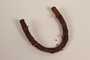 Metal horseshoe-shaped heel plate recovered from Chelmno killing center