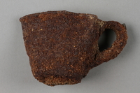 1989.308.2 side a
Rusted, crushed cup recovered from Chelmno killing center

Click to enlarge