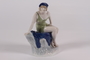 Porcelain figurine of a seated female acquired from Adolf Hitler’s Munich apartment