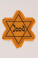 1996.151.1 front
Star of David badge with Jood printed in the center

Click to enlarge