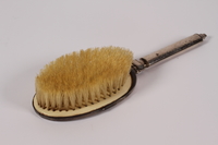 2005.600.4 back
Silver hair brush used by a German Jewish woman while in hiding

Click to enlarge