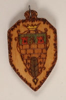 1989.342.11 front
Small colored wooden pendant with the Terezin crest made by a former Jewish Czech concentration camp inmate

Click to enlarge