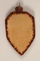 1989.342.11 back
Small colored wooden pendant with the Terezin crest made by a former Jewish Czech concentration camp inmate

Click to enlarge