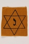 Yellow cloth Star of David badge with the letter J. to identify a Belgian Jew