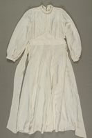 1999.7.12_a front
Wedding gown made from a white rayon parachute worn by multiple Jewish brides in a DP camp

Click to enlarge
