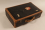 Black suitcase with leather trim used by a German Jewish Kindertransport refugee