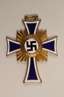 2000.263.1 front
Cross of Honor of the German Mother medal, with ribbon, 1st Class Order, Gold Cross

Click to enlarge