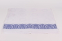 Embroidered tablecloth with blue floral design owned by a Jewish woman