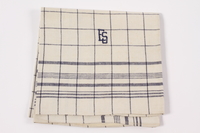 2012.485.6 front
Black checked towel embroidered ES saved by German Jewish refugees

Click to enlarge