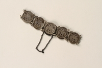 1990.121.1 back
Silver coin bracelet worn by a German Sinti woman

Click to enlarge