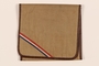 Brown cloth bag with a red, white, and blue stripe carried by a hidden Dutch Jewish woman
