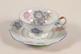 Teacup and saucer with blue and pink flowers carried by Kindertransport refugee